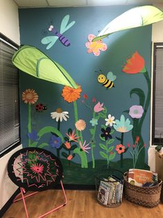 an office decorated with flowers and bugs on the wall