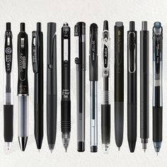 several different types of pens lined up in a row