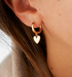 These heart earrings will be your new favorite everyday earrings. Classic and feminine, these huggie hoops make a simple statement as your sweetest new accessory. Stacked along multiple piercings to create your ultimate look.
Hoop size: 12mm, Heart: 10mm Earrings Huggies, Earring Inspo, Spring Inspo, Multiple Piercings, Earrings Classic, Moon And Star Earrings, Gold Rings Fashion, Luxury Earrings, Jewelry Fashion Trends