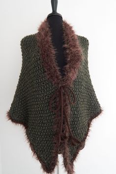 "Cozy up in this earth color shawl while watching your favorite TV series or reading Diana Gabaldon's book. I knitted this gorgeous wrap from soft wool/acrylic yarn. It is embellished with faux fur trim and cords that can be tied. AVAILABLE:  Size: Large US Measurements: Tip to tip: approx.69\" (175cm)  Top to bottom: approx.35\" (89cm)  See more shawls here - https://www.etsy.com/shop/KnitsomeStudio/items?section_id=25373486 and here - https://www.etsy.com/shop/KnitsomeStudio?section_id=6598836 Don't forget to check out my other items! There are many more in my shop -- http://knitsomestudio.etsy.com Copyright © 2024, Knitsome, LLC" Winter Crochet Shawl Wrap, Winter Shawl Knitting Pattern One Size, Winter Knitted Acrylic Shawl, Crochet Shawl Wrap For Winter, Winter Knitted Acrylic Yarn Shawl, Winter Knit Wraps One Size, Winter Acrylic Yarn Knit Shawl, Knit Shawl Wrap For Winter, Winter Shawl Knitting Pattern