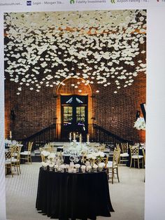 an image of a wedding reception with flowers on the ceiling