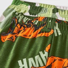 Help them travel to Isla Nublar in their dreamland in this 4-Piece Jurassic World Dinosaur Long-Sleeve Cotton Snug-Fit Pajama Set. This set includes two pairs of PJs, with each piece crafted from 100% cotton with ribbed cuffs and ankles for all-night cozy comfort. One pair includes a long-sleeve tee featuring the Jurassic Park logo on the front on a green camouflage print and accompanying pajama pants with the same green camouflage print. The other pair includes a long-sleeve tee and pajama pant Casual Green Sets With Dinosaur Print, Casual Dinosaur Print Bottoms For Playtime, Casual Green Dinosaur Print Sets, Cotton Long Sleeve Sets With Dinosaur Print, Cotton Sets With Dinosaur Print And Short Sleeves, Green Dinosaur Print Sets For Playwear, Cotton Long Sleeve Dinosaur Print Set, Pajama Set Dinosaur, Green Dinosaur Print Playwear Sets