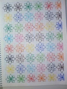 a notebook with some colored paper on it and an image of a pattern in the middle