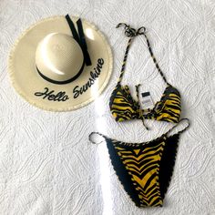 Kendall +Kyle Edgy, 2 Piece Swimsuit En Vogue Swim Look. Gets All The Attention. Very Sexycolor: Macro Tiger - Black & Bright Yellow. Bikini Top Back Tie Closure. Fully Lined - Imported - Hand Wash Fabric: Self: 80% Nylon, 20% Spandex Lining: 90% Polyester, 10% Spandex . Bottoms Mesh Trim Adds A Sporty Touch To These Cheeky Coverage Bikini Bottoms. Brings Instant Versatility To Your Beach Collection. Chic Yellow Swimwear For Beach, Chic Yellow Swimwear For Summer, Chic Yellow Swimwear For Pool, Chic Yellow Swimwear For The Pool, Chic Yellow Stretch Swimwear, Chic Yellow Swimwear For Spring, Fitted Yellow Tropical Swimwear, Trendy Yellow Swimwear For Poolside, Trendy Yellow Swimwear For Beach Party