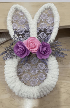 an easter bunny made out of crochet and flowers