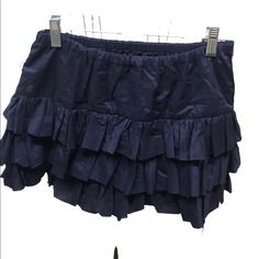 Navy Ruffled Skirt Elastic Waist 100% Cotton Waist Flat 13 Inches Approximately Length 13 1/2 Inches Approximately Closet #2a Blue Cotton Bottoms With Ruffle Hem, School Skirt With Ruffles In Cotton, School Skirt With Cotton Ruffles, Cotton Mini Skort With Ruffles, Tiered Blue Skirt With Ruffles, Tiered Ruffle Cotton Skort, Spring Mini Skirt By Ralph Lauren, Casual Ruffled Skirt For School, Blue Tiered Skirt With Ruffles