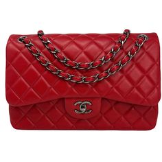 Chanel Classic Jumbo Double Flap Bag From 2014 with Gunmetal Hardware,Chain/Leather Straps,Interlocking CC Turn Lock Closure and Multiple Interior Compartments. Auth # 19986686 with Dustbag Designer = Chanel Color = Red Material = Lambskin Leather Condition = Very Good Height = 7.5 Width = 12 Depth = 3 1/2" Class = Premier Location: Chicago Item Number: 18321-1 Item ID: 255679 Category: Shoulder Bag Luxury Red Shoulder Bag With Palladium Hardware, Red Designer Bag With Double Flap, Red Designer Bags With Double Flap, Designer Red Double Flap Bag, Red Formal Bags With Double Flap, Classic Red Bag With Chain Strap, Classic Red Shoulder Bag With Chain Strap, Chanel Classic Jumbo, Gunmetal Hardware