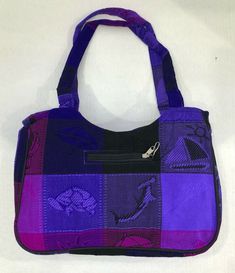 This is a one of a kind bag hand crafted in Mexico from patches of beautiful Huipil fabric. The bag is very chic and durable with zipper closure, quite versatile.  Approximate Measurements- 15 in. X 6 1/2 in. X 11 in.  Strap measurement- 37 in.  Little bag- 4 in. X 3 1/2 in.  Feel free to ask questions.Thank you. Traditional Purple Rectangular Bag, Traditional Rectangular Beach Bag For Gifts, Traditional Rectangular Beach Bag For Gift, Traditional Rectangular Beach Bag As Gift, Traditional Purple Rectangular Shoulder Bag, Traditional Bags With Zipper Pouch For Daily Use, Rectangular Purple Shoulder Bag With Zipper Pouch, Purple Rectangular Shoulder Bag With Zipper Pouch, Beach Purse