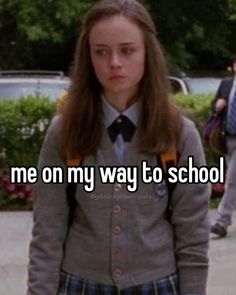 a girl in a school uniform with the words me on my way to school