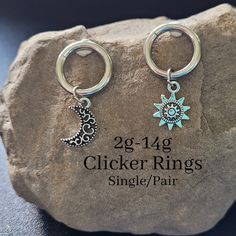 "316L Surgical Steel, Hypoallergenic Big gauge hinged clicker hoops with sun and moon charms. Easy on and off. Hoop diameter: 1/2\" 12mm Choose 2g 4g 6g 8g 10g 12g or 14g PERSONALIZATION BOX If selecting single, please write sun or moon in Personalization box. Want to see more of this style with different charms? Click here: https://www.etsy.com/shop/TikiTorchDesigns?ref=seller-platform-mcnav&section_id=42801008 -- 2 in 1: charms can be removed to wear hoop plain and/or in a stretched septum -- Nickel-free Silver Dangle Belly Rings, Silver Dangle Belly Rings Nickel Free, Bohemian Belly Rings As A Gift, Silver Hypoallergenic Dangle Belly Rings, Nickel-free Silver Metal Belly Rings, Hypoallergenic Silver Dangle Belly Rings, Nickel-free Celestial Silver Piercings, Celestial Nickel-free Silver Piercings, Adjustable Dangle Belly Rings