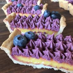 blueberries and cheesecake are arranged on top of each other