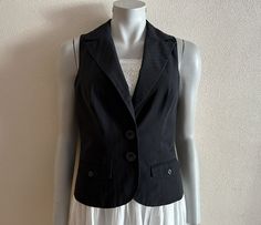 "Women's Vest Black Vest Black Womens Waistcoat Steampunk Formal Fitted Suit Collar Waistcoat Victorian Renaissance Baroque Edwardian Medium Size Measurements (lying flat): Length(back): 21\"/ 53.5 cm Pit to pit: 17 3/4\"/ 45 cm Waist: 15.5\"/ 39.5 cm Please check measurements to insure a proper fit. Remember to allow yourself some extra room for movement. You can compare these with something from your closet that fits you well. Condition: great Vintage Condition SHIPPING * I ship worldwide via Steampunk Formal, Womens Waistcoat, Womens Black Vest, Suit Collar, Fitted Suit, Black Vest, Vest Outfits, Extra Room, Women's Vest