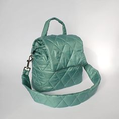 Green mint bucket bag quilted with detachable strap. Handmade green nylon bucket shoulder bag for women. Height - 23 cm  ( 9,05 " ) Width - 31 cm   ( 12,20 " ) Depth - 9 cm ( 3,54 " ) Strap  - 75 cm  ( 29,53 " ) Green mint bucket bag made of quilted nylon fabric. Green shoulder bag has cotton lining, 1 pocket inside, detachable strap. The mint green bag fastens with 1 magnetic button. Green mini bag quilted for women. Mint mini shoulder bag quilted drawstring. Beautiful small handbag light green Green Bucket Bag With Zipper Closure, Green Quilted Shoulder Bag For Travel, Quilted Green Shoulder Bag For Travel, Green Bucket Bag With Detachable Strap For Travel, Green Quilted Crossbody Shoulder Bag, Trendy Green Quilted Shoulder Bag, Green Nylon Bag With Detachable Strap, Green Quilted Bag For Daily Use, Green Quilted Tote Shoulder Bag