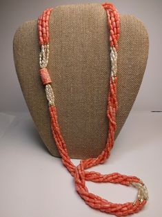 This mid-century multi-strand necklace is a beautiful combination of natural coral and Kashi (river) pearls. The five-strand necklace contrasts the pink coral with luminescent river pearls and 14k yellow gold beads. The long 32-inch length easily slips on for a seamless design. A large, carved coral bead with an Asian motif is the finishing touch of this special necklace. * 32-inch length * 5 strands * Coral and Kashi (river) pearl beads * 14k gold accent beads Thank you for visiting Second Chap Coral Double Strand Jewelry As Gift, Coral Double Strand Jewelry For Gifts, Coral Double Strand Jewelry Gift, Coral Double Strand Necklace For Gift, Double Strand Coral Necklace For Gifts, Elegant Double Strand Coral Necklace, Traditional Single Strand Coral Jewelry, Pink Multi-strand Hand-strung Jewelry, Hand-strung Multi-strand Pink Jewelry