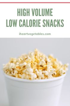 a white bowl filled with popcorn and the words high volume low calorie snacks