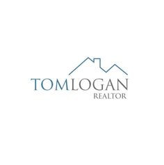 the logo for tomlogan realtor, which is located on top of a mountain