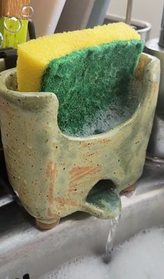 a sponge sits on top of a sink