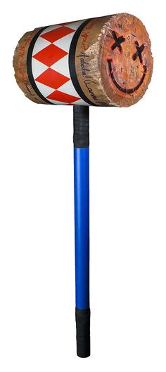 a close up of a baseball bat on a stick with a smiley face painted on it