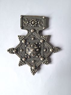 Morocco - Mauritania - Rare large granulated cross "Boghdad" in sterling silver  Adorned with a rosette engraved on the back Height: 95 mm Width: 80 mm Weight: 66.90 grams Feel free to contact me for any question about this item, I will be happy to answer you as soon as possible Visit my Etsy Shop: https://www.etsy.com/fr/shop/TIFINAGH Silver Byzantine Cross Jewelry, Ceremonial Byzantine Silver Jewelry, Silver Byzantine Ceremonial Jewelry, Silver Byzantine Jewelry For Ceremonies, Traditional Collectible Cross Jewelry, Traditional Cross Pendant Large Jewelry, Traditional Cross Jewelry For Collectors, Ornate Silver Cross Jewelry, Ceremonial Silver Cross Jewelry