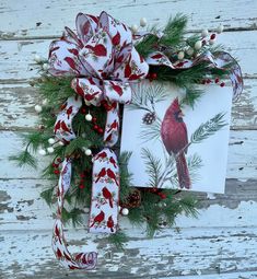 a christmas wreath with a cardinal on it