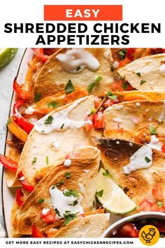 easy shredded chicken appetizers on a platter with limes and cilantro