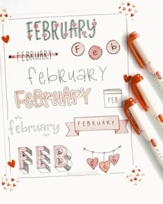 two pens are sitting on top of a paper with the words february written in it