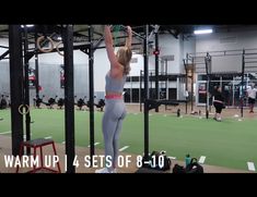 a woman is doing exercises in the gym