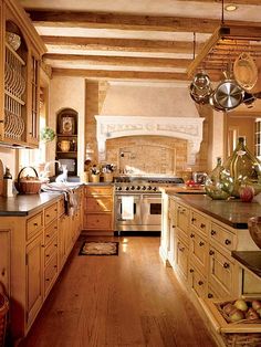 a kitchen filled with lots of wooden cabinets and counter top space next to an oven