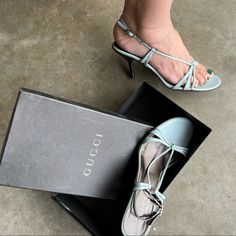 -Gucci Strappy Sandals With Heels -Size Eu 37.5 -Milky Blue Leather Upper -Black Heels -Leather Inside & Leather Soles -Box Is Included -New In Box Vever Used -Please Check Last Pic For Mini Flaws -Please Zoom In All Pictures And Ask Questions Also Fully Read Description -Authentic Gucci Slingback Party Sandals, Gucci Slingback Sandals For Party, Gucci Slingback Sandals With Heel Strap, Gucci Designer Slingback Sandals, Gucci Leather Slingback Sandals, Designer Gucci Slingback Sandals, Luxury Gucci Slingback Sandals, Gucci Heels With Heel Strap And Open Heel, Blue Leather Gucci Sandals