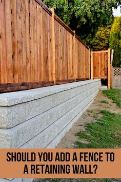 a retaining wall with the words should you add a fence to a retaining wall?