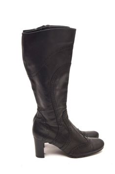 If you are looking for a pair of boots that are stylish, comfortable, and versatile, look no further than these vintage 90s pebbled leather tall boots. These boots are made of genuine leather that has a pebbled texture, giving them a unique and rugged appearance. The chunky heel is about 2.5 inches (6 cm) high, providing stability and support for your feet. The rounded toe shape is flattering and comfortable, and the shaft is about 13 inches (34 cm) high, reaching just below your knees. These bo Retro Leather Winter Boots, Vintage Faux Leather Winter Boots, Vintage Winter Boots In Faux Leather, Vintage Faux Leather Boots For Fall, Retro Leather Boots For Fall, Vintage Faux Leather Boots With Round Toe, Vintage Faux Leather Round Toe Boots, Retro Medium Width Boots For Fall, Retro Medium Width High Heel Boots