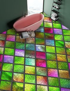 a bath tub sitting on top of a colorful floor