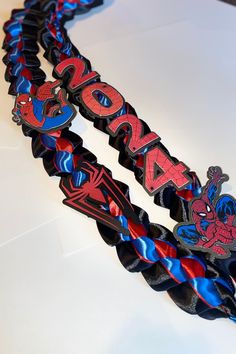 the spiderman bracelet is on display for people to see