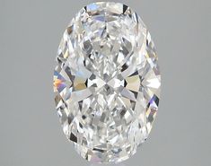 an oval cut diamond on a gray background