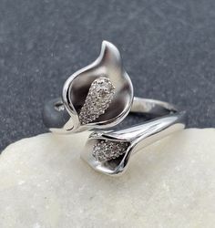 Beautiful, QVC, Affinity Diamonds 925 Sterling Silver Calla Lily Bypass Diamond Ring . This beautiful ring is sure to receive many compliments! SOLID925 STERLING SILVER, FULLY TESTED, NOT PLATED OR FILLED. Ring Size: 10.25 Width: 19mm - 3mm Gemstone: Diamond Weight: 6.1 Grams Hallmarked: EA / 925 / China We gladly combine shipping! Everything is packed with care to make sure it arrives safely. We only sell authentic items. If it is a name brand item, we guarantee it to be authentic. If it is mad John 3 16, Bypass Ring, Beautiful Ring, Calla Lily, Rings Statement, Precious Metals, Beautiful Rings, Favorite Jewelry, Statement Rings