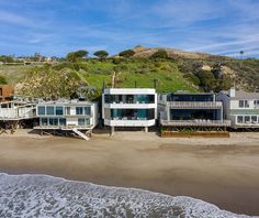 an aerial view of houses on the beach