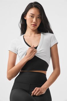 Hello, curves. The Seamless Ribbed Serene Short Sleeve keeps things cool with forward, matching curves at the neckline and hem. Made from a thick, ribbed, cotton-y fabric, this cute crop offers light, everyday support without lining or cups. Pair it up with leggings or chill sweat shorts and slides and head out. Ribbed, cotton-y crop top Forward curved hem and deep scoop neckline Designed & uniquely fit to flatter every size Wear-tested by our in-house team for the perfect fit Stretch Seamless Crop Top For Layering, Stretch Seamless Top For Layering, Seamless Stretch Top For Layering, Stretch Tops With Seamless Construction For Layering, Fitted White Tops With Ribbing, White Fitted Top With Ribbing, White Fitted Tops With Ribbing, White Seamless Crop Top For Layering, Compressive Seamless Top For Layering