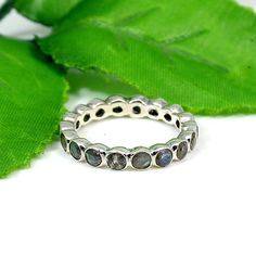 Labradorite Ring- Round Gemstone Ring- 925 Sterling Silver- Bezel Ring- Stackable Ring- Eternity Wedding Ring- Flashy Labradorite- Bohemian Ring Detail: Gemstone : Labradorite Metal : 925 Sterling Silver Material : Silver, Gemstone Weight : 3.19 Gram Approx Stone Size : 3 MM Approx SKU : BM-1430 Handmade Item **Made To Order** For more silver jewelry designs please visit our store : https://www.etsy.com/shop/BijouxMaison Adjustable Stackable Rings With Natural Stones For Anniversary, Spiritual Style Stackable Rings With Natural Stones, Bohemian Gemstone Stackable Rings For Anniversary, Silver Stackable Rings With Natural Stones, Bohemian Jewelry With Bezel Setting In Round Shape, Adjustable Stackable Rings With Stone Setting, Bohemian Round Jewelry With Bezel Setting, Bohemian Round Bezel Set Jewelry, Adjustable Silver Stackable Rings With Stones