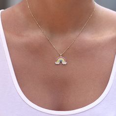 "Rock a dazzling dash of color in CZ Rainbow Necklace, featuring an array of sparkly clouds attached to a dreamy rainbow pendant. Wear this gem with a cute choker, and a vibrant blouse for a chic, layered look that'll make heads turn anywhere you go. Adjustable Rainbow Charm Necklace - 14K Gold or Rhodium Plated 925 Silver - 14\" + 3 Extender Aveg. Weight: 3.75 grams Sterling Silver 14K Gold Plated and Rhodium Plated Cubic Zirconia Stones Length: 14\" + 3\" Extender Lead And Nickle Free Free Gif Dainty Rainbow Jewelry For Everyday Wear, Hijab Drawing, Rainbow Pendant, How To Look Rich, Rainbow Necklace, Rock A, Link Necklace, Spring Rings, Shop Necklaces