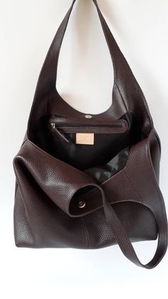 "This hand bag is crafted from textured soft leather in brown . It's the ideal size for taking you from desk to dinner, and can be worn over the shoulder for hands-free. - Two shoulder straps. - Pleated top with magnetic fastening. - You can choose from 6 leather colors. - Cotton lining with zip close compartment for securing your necessities, you can choose from 7 different linings. Free delivery is economic delivery. We use Latvian post and delivery can take 1-3 weeks in the EU, 3-4 weeks ever Brown Hobo Bag Outfit, Soft Leather Hobo Satchel, Brown Hobo Bag With Leather Backing, Brown Textured Leather Hobo Bag For Travel, Leather Hobo Bag Tote With Soft Leather, Soft Bag, Vintage Leather Hobo Bag, Brown Hobo Bag For Shopping, Vintage Purse Aesthetic