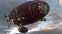 a large red hot air balloon flying through a cloudy sky