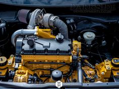 the engine compartment of a car with it's hood up and two turbo engines