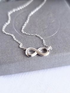 This stunning infinity necklace is made of 925 Sterling Silver, complete with an 11-5mm Infinity Charm.  The cable chain measures 44cm in length, and has an extra 2cm extension. It is minimalist yet elegant, and is designed to be worn day or night, making the perfect birthday of Christmas gift for someone you love. All MysticSilver jewellery is 925 Sterling Silver, Hypoallergenic, and is Nickel and Lead free. PACKAGING Your order will be carefully wrapped in specially formulated tissue paper, which is designed to ensure your jewellery stays tarnish free, and then placed in a pretty organza bag. Or you can choose to upgrade to one of our beautiful MysticSilver gift boxes, which make the perfect packaging for presents. DELIVERY Your order will be posted usually within 1-2 working days by Roy Infinity Cable Chain Jewelry Gift, Infinity Jewellery, Pretty Valentines, Infinity Necklace Silver, Birthday Presents For Friends, The Summer I Turned Pretty, Infinity Charm, Infinity Jewelry, Pendant Choker