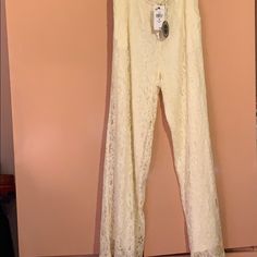 Nwt Hazel Ivory Lace Bell Bottom Pants Fully Lined. Draw String At Top With Slash Pockets. Beautifully Made Size Medium Will Be Happy To Bundle Beige Lace Bottoms For Spring, Spring Lace Beige Bottoms, Spring Beige Lace Bottoms, White Lace Casual Pants, Casual Lace Beige Bottoms, Lace Bell Bottoms, Jumper Skirt, Halter Jumpsuit, Bell Bottom Pants