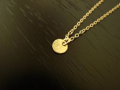 This beautiful 24k vermeil ( gold over sterling silver) disc measures 6x6mm , and floats freely on a gold filled chain, including a spring clasp in gold filled. Your item comes wonderfully boxed and wrapped so you can give it as a gift - or enjoy opening it as a gift yourself! Please note that gold filled jewelry and components have a much higher gold content, and are much more durable and tarnish resistant than gold plated. Gold filled jewelry is also a wonderful and affordable alternative to s Gold Charm Necklaces With Round Pendant, Gold Charm Necklace With Round Pendant, Simple Gold Round Disc Necklaces, Minimalist Gold Coin Necklace In 14k Gold Filled, Dainty Hammered Coin Necklace As Gift, Simple Gold Charm Necklace With Round Disc, Gold Delicate Minimalist Charm Necklaces, Dainty 14k Gold Filled Coin Necklace, Small Gold Round Pendant Necklace