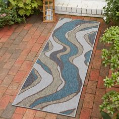 an outdoor area rug is shown on the ground