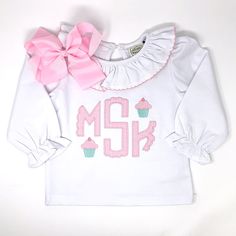 Our Scallop Monogram Applique Girls Top is perfect for your little one. Choose your favorite style top, your fabric and mini embroidery design. Cotton Long Sleeve Top With Appliques, Long Sleeve School Tops With Embroidered Text, Fitted White Tops With Machine Embroidery, Fitted White Top With Machine Embroidery, White Fitted Top With Machine Embroidery, Customizable Cute Cotton Tops, Fitted Long Sleeve Top With Custom Embroidery, Customizable Cute Long Sleeve Top, Cute Cotton Tops With Machine Embroidery