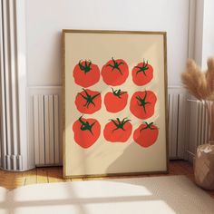 an art print with tomatoes on it in front of a radiator