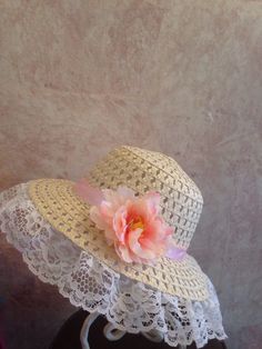 This is a beige straw hat trimmed in white lace with light pink satin ribbon and lovely pink flower. This hat fits smaller girls 18-20.5 inches head circumference. Spring Sun Hat With Crochet Trim And Curved Brim, Spring Wide Brim Hat With Crochet Trim, Wide Brim Hat With Crochet Trim For Spring, Spring Crochet Hat With Crochet Trim, Pink Flower Hat For The Beach, Pink Flower Hat For Beach, Spring Beach Crochet Hat With Flower Shape, Pink Cap Mini Hat For Summer, Cute Flower Hat For Beach