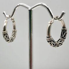 ABSOLUTELY SHIMMERING STERLING SILVER Hinged Hoop EARRINGS !! A delight for your ears, these wonderful sterling silver hoop earrings has been hand made using sterling silver wire in an exotic design. These hoops are hinged to make them easier to put on. This sterling silver shimmers with your every move! NOTE: Images do not reflect number and size. Please see detail and table for information. Quantity: 1 Pair of Earrings Material Type: Sterling Silver Size: 17x3mm Color: Silver Legend: What a fu Hypoallergenic Silver Huggie Earrings In Sterling Silver, Hypoallergenic Silver Sterling Huggie Earrings, Hypoallergenic Sterling Silver Huggie Earrings, Silver Nickel-free Huggie Hoop Earrings, Small Hoop Sterling Silver Earrings For Pierced Ears, Adjustable Sterling Silver Huggie Earrings, Small Hoop Nickel-free Sterling Silver Earrings, Small Hoop Sterling Silver Nickel-free Earrings, Nickel-free Small Hoop Sterling Silver Earrings